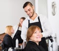 Barber makes the cut for woman Royalty Free Stock Photo