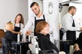 Barber makes the cut for woman Royalty Free Stock Photo