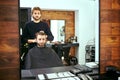 Barber makes men haircut at the beauty salon Royalty Free Stock Photo