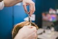 Barber Making Haircut Bearded Man In Barbershop. Professional stylist cutting client hair in salon. Barber using Royalty Free Stock Photo