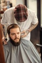 Barber man grooming with scissors of real hipster