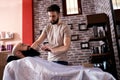 Barber with old-fashioned black razor Royalty Free Stock Photo