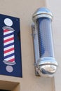 Barber round black grey colored pole shop sign silver and classic blue white red color