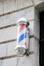 Barber round bleu red white round pole shop sign silver in vintage hairdresser facade