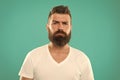 Barber salon. Beard fashion and barber concept. Man bearded hipster stylish beard turquoise background. Barber tips