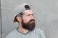 Barber salon and facial hair care. Hipster lifestyle. Cool hipster with beard wear stylish baseball cap. Brutal handsome