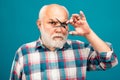 Barber scissors. Portrait of old bald man bearded man with grey moustache beard.