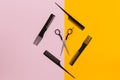 Barber set with combs and scissors on pink and yellow background Royalty Free Stock Photo