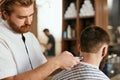Barber Shop Men Hair Cut. Barber Doing Men Fashion Hairstyle Royalty Free Stock Photo