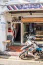 Motorbike outside a barber shop