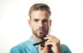 Barber shop. Unshaven man in denim shirt with vintage razor at barbershop. Brutal bearded man with straight razor Royalty Free Stock Photo