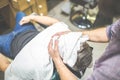 Barber softening male face skin with hot towel at barbershop