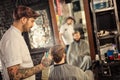 Barber sprinkles a client with water Royalty Free Stock Photo