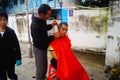 Shenzhen, China: the hairdresser is on the street, the charge is cheap