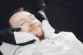 Barber steam face skin of man with hot towel before royal shave in Barbershop Royalty Free Stock Photo