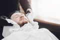 Barber steam face skin of man with hot towel before royal shave in Barbershop Royalty Free Stock Photo