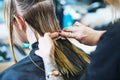 Barber or stylist at work. Hairdresser cutting woman hair Royalty Free Stock Photo