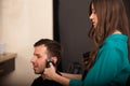 Barber trimming sideburns Royalty Free Stock Photo