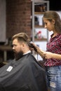 Barber woman making haircut Royalty Free Stock Photo