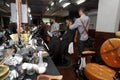 Barber working in barbershop