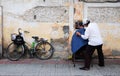 Barber working on street in Hanoi, Vietnam