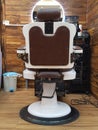 Barbershop armchair, modern hair salon, barber shop for men. Stylish vintage barber chair. Royalty Free Stock Photo