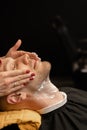 Barbershop, closeup: a barber applying shaving gel to beard