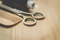 Barbershop concept. Hairbrushes, sprayer and a scissors on a wooden board, selective focus and copy space