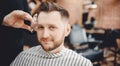 Barbershop concept. Hairdressers barber haircut men in salon