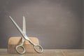 Barbershop concept. Old style. Hairbrushes and a scissors on a gray background with copy space. Selective focus Royalty Free Stock Photo