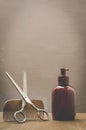 Barbershop concept. Old style. Hairbrushes, sprayer and a scissors on a gray background. Selective focus Royalty Free Stock Photo