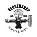 Barbershop emblem with shaving brush and razor Royalty Free Stock Photo