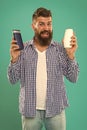 Barbershop and hair care. Wash hair with shampoo. Hair conditioner or lotion. Make right choice. Man bearded hipster Royalty Free Stock Photo