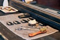 Barbershop haircut tools barber equipment on wooden countertop front of mirror, old vintage interior Royalty Free Stock Photo