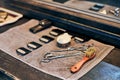 Barbershop haircut tools barber equipment on wooden countertop front of mirror, old vintage interior Royalty Free Stock Photo