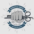 Barbershop logo design with hand holding scissors Royalty Free Stock Photo