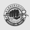 Barbershop logo design with hand holding scissors Royalty Free Stock Photo