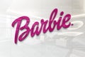 Barbie brand on glossy office wall realistic texture