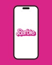 Barbie logo on the smartphone iPhone 14 or 15 screen isolated on pink background. Barbie is a 2023 American fantasy