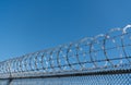 barbwire perimeter fence. ensuring safety and security. jail wall. Royalty Free Stock Photo