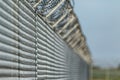 Barbwired fence suggesting illegal immigration