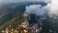 Aerial view of Barcelona Tibidabo above the clouds and fog, Catalonia, Spain