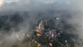 Aerial view of Barcelona Tibidabo above the clouds and fog, Catalonia, Spain