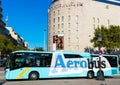 Barcelona Airport express shuttle bus Aerobus outside El Corte Ingles department store at Placa de Catalunya - Barcelona, Spain -