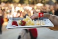 BARCELONA, CATALONIA - APRIL 2, 2022: All Those food market in Barcelona, Catalonia. Close up of tray of Swiss cheeses outdoor