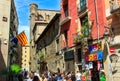 Barcelona, Catalonia, Spain - July 9, 2014: View of medeival street in old town in summer. Traditional architecture, people, life.