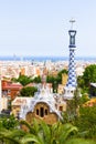 Gaudi`s building with mosaic tower with four-armed cross in Park Guell