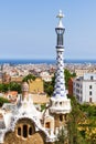 Gaudi`s building with tower with typical four-armed cross in Park Guell