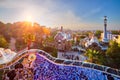 Barcelona city view from Guell Park. Sunrise view of colorful mosaic building in Park Guell