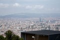 Barcelona cityscape from a high vantage point. Dense buildings, mountain backdrop, and modern structure Royalty Free Stock Photo